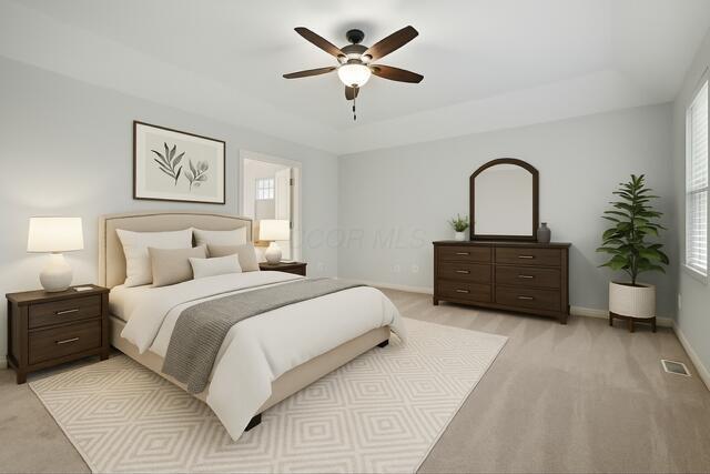 273 Blue Jacket Cir, Pickerington, OH 43147 - bedroom with a raised ceiling, baseboards, light colored carpet, and multiple windows