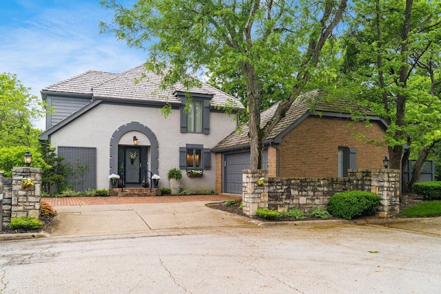 8547 Pitlochry Ct, Dublin, OH 43017 - view of front of house featuring driveway, an attached garage, and brick siding