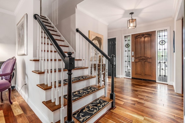 8547 Pitlochry Ct, Dublin, OH 43017 - entrance foyer featuring stairs, wood finished floors, baseboards, and ornamental molding