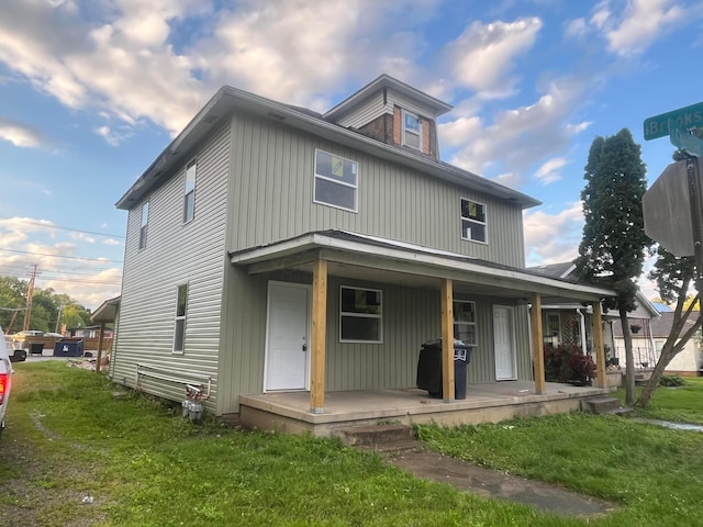1107 E Chestnut St 1105, Lancaster, OH 43130 - view of front of home featuring covered porch and a front yard