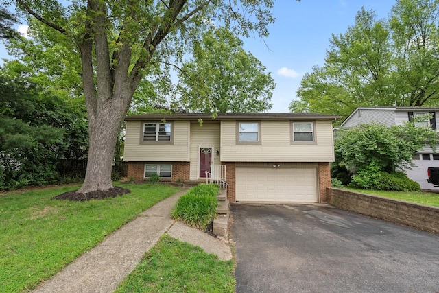 4373 Valley Quail Blvd S, Westerville, OH 43081 - raised ranch featuring driveway, a garage, brick siding, and a front yard