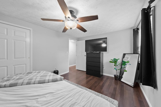 4373 Valley Quail Blvd S, Westerville, OH 43081 - bedroom with baseboards, dark wood finished floors, a textured ceiling, and ceiling fan