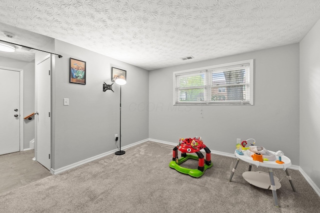 4373 Valley Quail Blvd S, Westerville, OH 43081 - game room featuring carpet floors, baseboards, and a textured ceiling