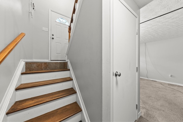 4373 Valley Quail Blvd S, Westerville, OH 43081 - staircase with a textured ceiling, carpet, and baseboards