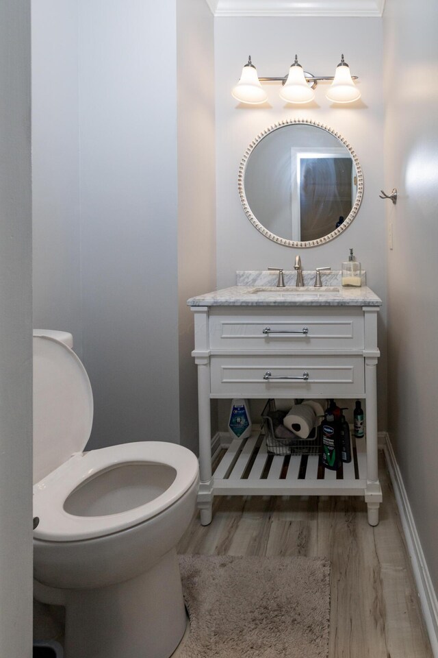 3243 Brookview Way Unit 68, Columbus, OH 43221 - half bathroom with toilet, wood finished floors, vanity, and baseboards