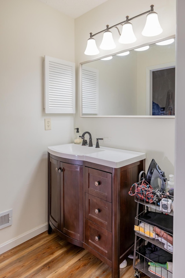 3243 Brookview Way Unit 68, Columbus, OH 43221 - bathroom featuring wood finished floors, baseboards, and vanity