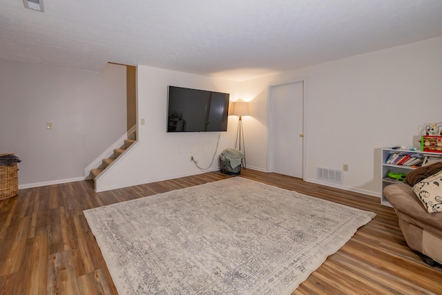 3243 Brookview Way Unit 68, Columbus, OH 43221 - living area featuring stairs, baseboards, and wood finished floors