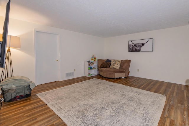 3243 Brookview Way Unit 68, Columbus, OH 43221 - living area featuring dark wood finished floors and baseboards