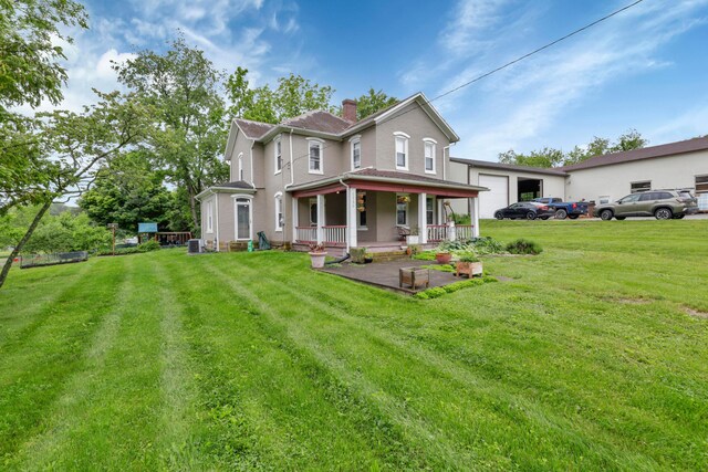 1904 Cedar Hill Rd, Lancaster, OH 43130 - victorian-style house with a porch, a chimney, a front lawn, and central AC unit