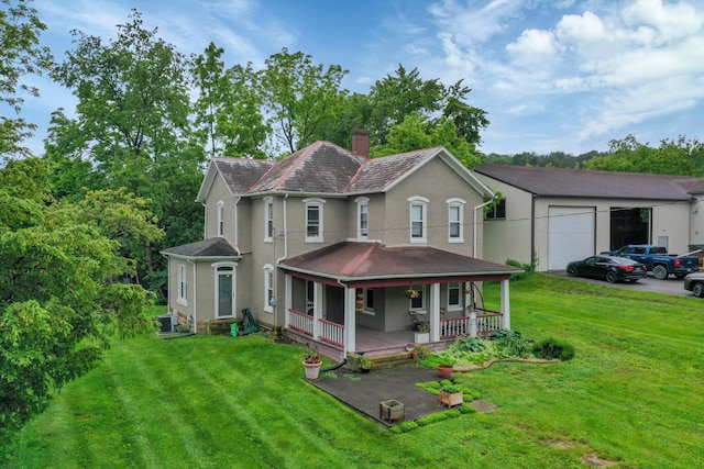 1904 Cedar Hill Rd, Lancaster, OH 43130 - back of property featuring a chimney, covered porch, a lawn, and an attached garage