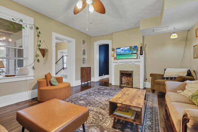 1904 Cedar Hill Rd, Lancaster, OH 43130 - living area with ceiling fan, wood finished floors, a fireplace, stairs, and baseboards