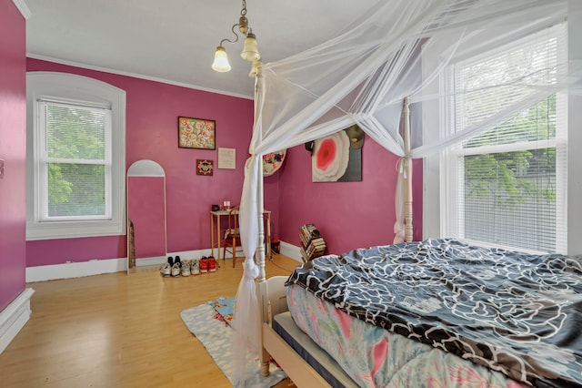 1904 Cedar Hill Rd, Lancaster, OH 43130 - bedroom featuring crown molding, wood finished floors, baseboard heating, and baseboards