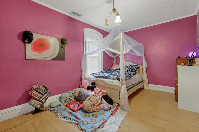 1904 Cedar Hill Rd, Lancaster, OH 43130 - bedroom with wood finished floors, ornamental molding, baseboards, and a textured ceiling