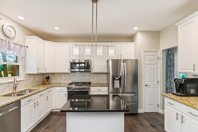 4560 Greyson Dr, Powell, OH 43065 - kitchen with stainless steel appliances, a sink, white cabinetry, and recessed lighting