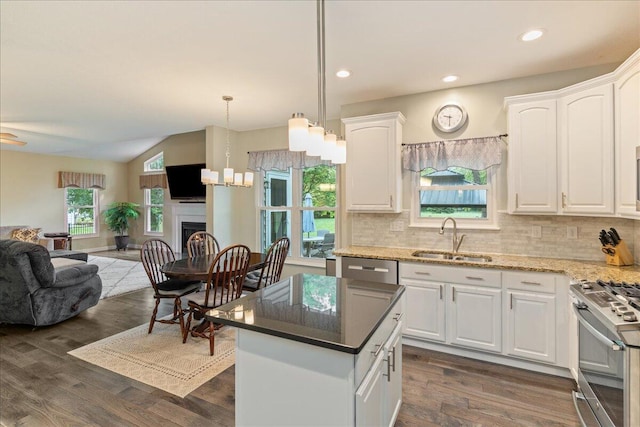 4560 Greyson Dr, Powell, OH 43065 - kitchen featuring a sink, open floor plan, stainless steel appliances, white cabinets, and tasteful backsplash