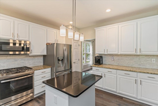 4560 Greyson Dr, Powell, OH 43065 - kitchen featuring stainless steel appliances, tasteful backsplash, dark wood-style floors, white cabinetry, and recessed lighting