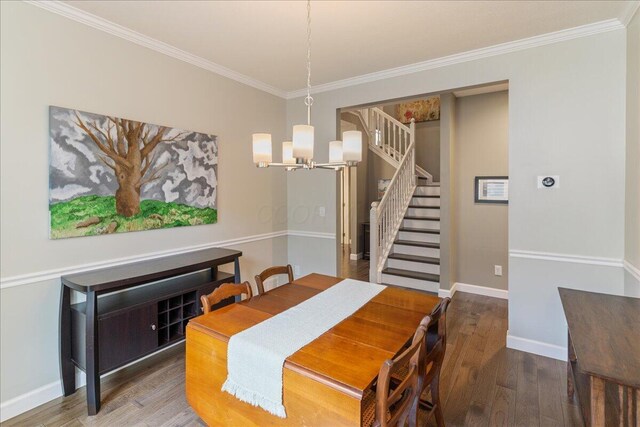 4560 Greyson Dr, Powell, OH 43065 - dining area with stairway, a chandelier, wood finished floors, crown molding, and baseboards