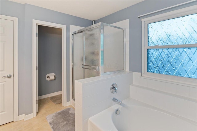 4560 Greyson Dr, Powell, OH 43065 - bathroom with a shower stall, a bath, tile patterned floors, and baseboards