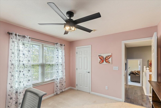 4560 Greyson Dr, Powell, OH 43065 - bedroom with baseboards, light carpet, and ceiling fan