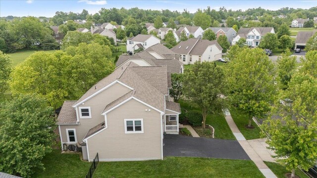 4560 Greyson Dr, Powell, OH 43065 - aerial view of residential area with a tree filled landscape