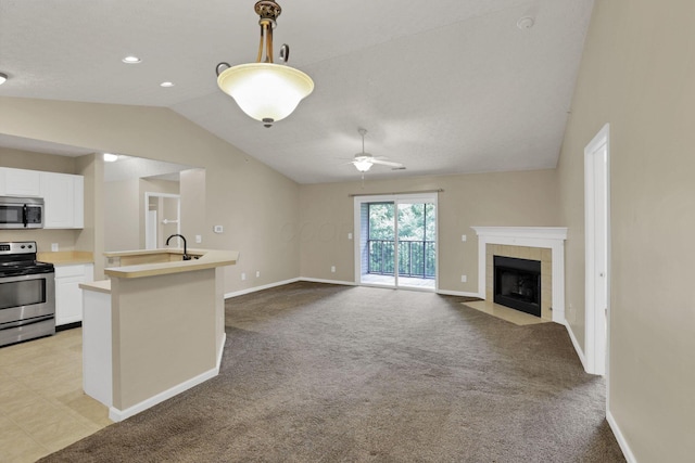108 Shelbourne Forest Way, Delaware, OH 43015 - kitchen featuring appliances with stainless steel finishes, lofted ceiling, light countertops, ceiling fan, and white cabinetry