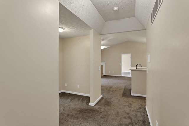 108 Shelbourne Forest Way, Delaware, OH 43015 - corridor featuring carpet floors, a textured ceiling, baseboards, and vaulted ceiling