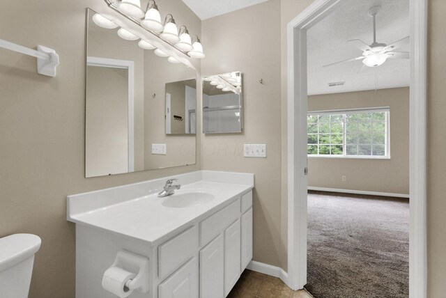 108 Shelbourne Forest Way, Delaware, OH 43015 - bathroom featuring toilet, vanity, ceiling fan, and baseboards