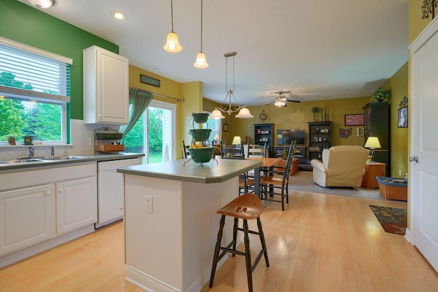 6612 Archie Ct, Canal Winchester, OH 43110 - kitchen featuring dishwasher, light wood finished floors, open floor plan, a kitchen island, and recessed lighting