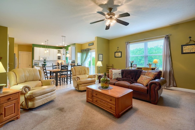 6612 Archie Ct, Canal Winchester, OH 43110 - living area with a ceiling fan, light carpet, and baseboards
