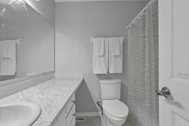6022 Brice Park Dr Unit 17D, Canal Winchester, OH 43110 - bathroom featuring vanity, toilet, baseboards, and a shower with curtain