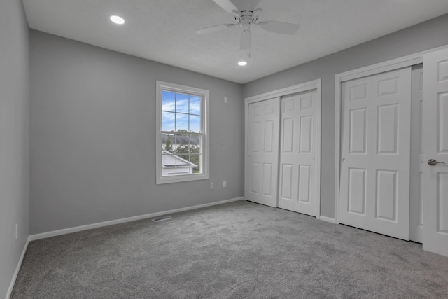 6022 Brice Park Dr Unit 17D, Canal Winchester, OH 43110 - unfurnished bedroom featuring carpet flooring, baseboards, two closets, recessed lighting, and a ceiling fan