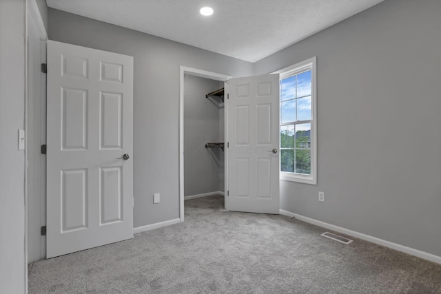 6022 Brice Park Dr Unit 17D, Canal Winchester, OH 43110 - unfurnished bedroom featuring carpet flooring, a spacious closet, baseboards, and a closet
