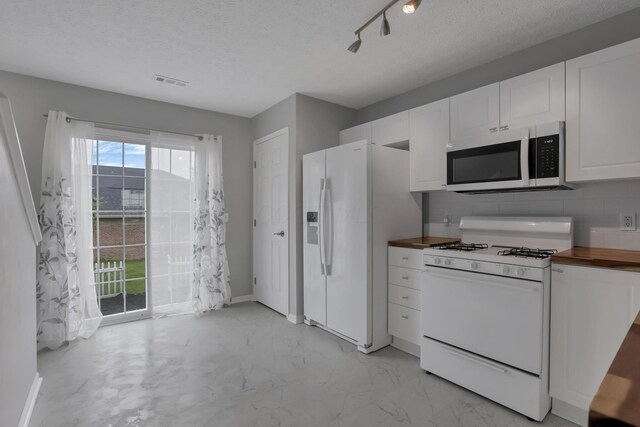 6022 Brice Park Dr Unit 17D, Canal Winchester, OH 43110 - kitchen with white appliances, wooden counters, white cabinetry, a textured ceiling, and baseboards