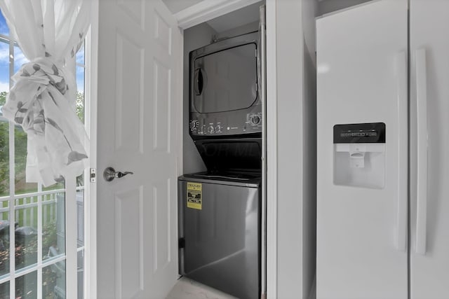 6022 Brice Park Dr Unit 17D, Canal Winchester, OH 43110 - laundry room featuring stacked washer and clothes dryer and plenty of natural light