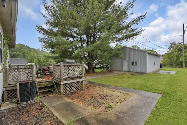 907 Fairfield Ave, Lancaster, OH 43130 - view of grassy yard with central AC unit and a deck