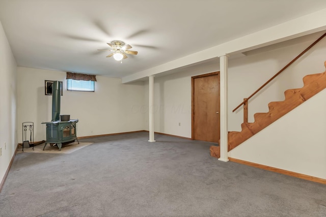 907 Fairfield Ave, Lancaster, OH 43130 - basement featuring a wood stove, carpet, stairs, and baseboards