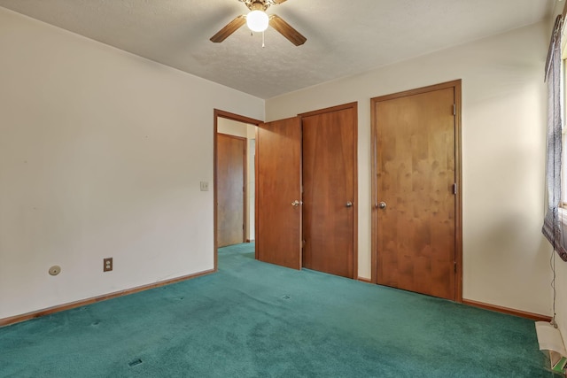 907 Fairfield Ave, Lancaster, OH 43130 - unfurnished bedroom featuring carpet floors, multiple closets, baseboards, and a ceiling fan