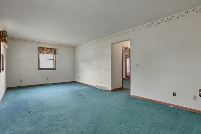 907 Fairfield Ave, Lancaster, OH 43130 - unfurnished room with carpet, a textured ceiling, and baseboards