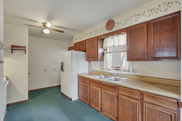 907 Fairfield Ave, Lancaster, OH 43130 - kitchen with white refrigerator with ice dispenser, a sink, a ceiling fan, light countertops, and dark colored carpet