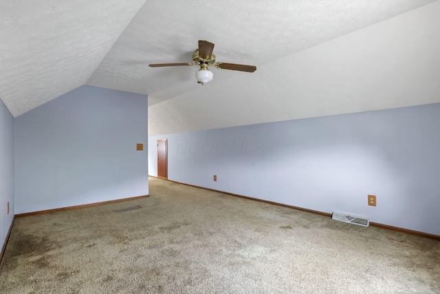 907 Fairfield Ave, Lancaster, OH 43130 - bonus room featuring carpet floors, lofted ceiling, baseboards, ceiling fan, and a textured ceiling