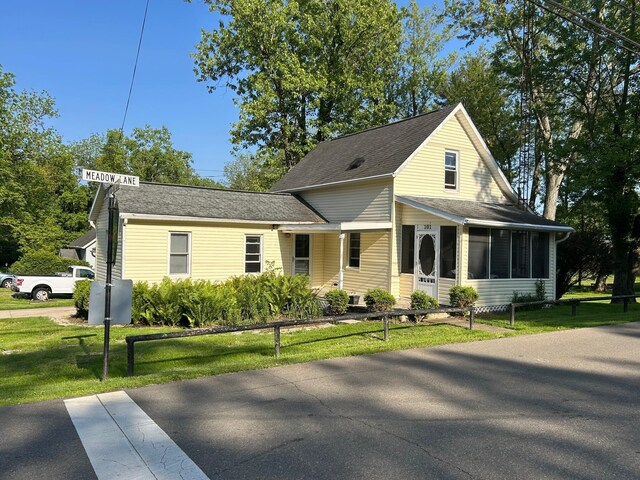 101 Meadow Ln, Gambier, OH 43022 - view of front of house featuring a front yard and a shingled roof