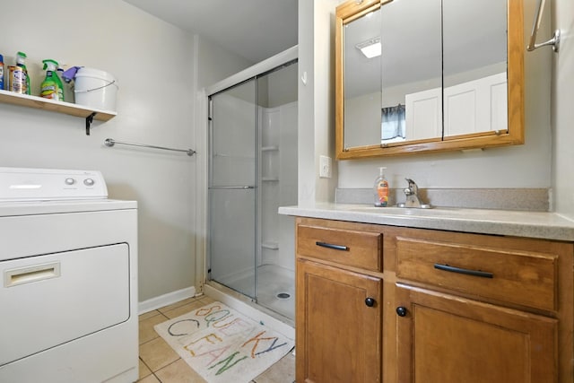 101 Meadow Ln, Gambier, OH 43022 - full bath featuring washer / clothes dryer, vanity, a stall shower, and tile patterned floors