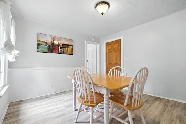 101 Meadow Ln, Gambier, OH 43022 - dining room featuring light wood-style flooring and a wainscoted wall