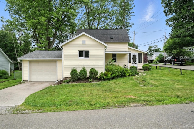 101 Meadow Ln, Gambier, OH 43022 - traditional-style house featuring concrete driveway, a front yard, an attached garage, and roof with shingles