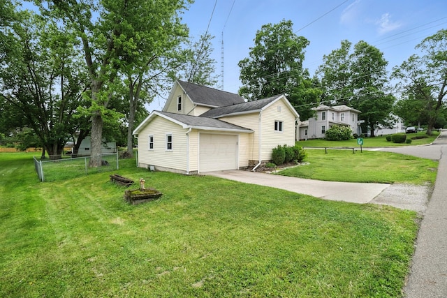 101 Meadow Ln, Gambier, OH 43022 - view of side of home featuring concrete driveway and an attached garage