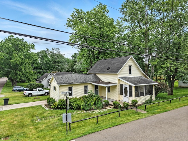 101 Meadow Ln, Gambier, OH 43022 - view of front facade with roof with shingles and a sunroom