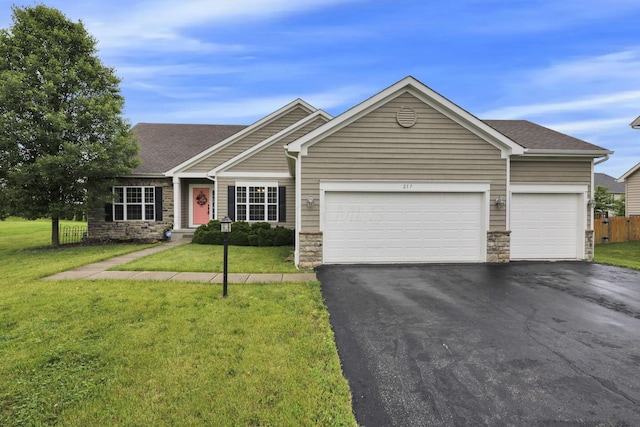 217 Warbler Ct, Pickerington, OH 43147 - single story home with stone siding, driveway, an attached garage, roof with shingles, and a front lawn