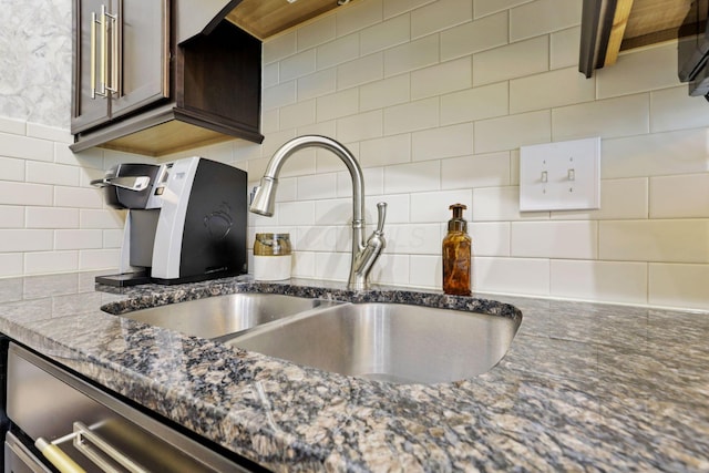 217 Warbler Ct, Pickerington, OH 43147 - kitchen view of a sink, decorative backsplash, and dark stone countertops