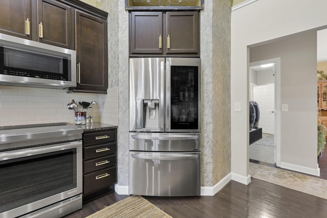 217 Warbler Ct, Pickerington, OH 43147 - kitchen featuring stainless steel appliances, dark wood-style floors, dark brown cabinets, and backsplash