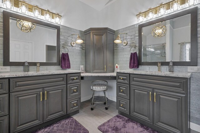217 Warbler Ct, Pickerington, OH 43147 - bathroom with a chandelier, tasteful backsplash, vanity, and a shower